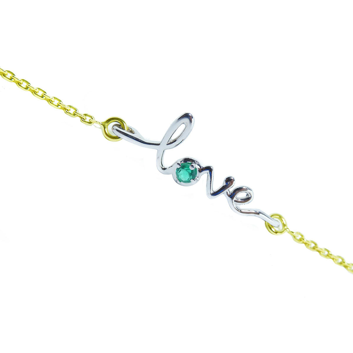 A bracelet with 'LOVE' center piece featuring a round cut emerald on a topside view.