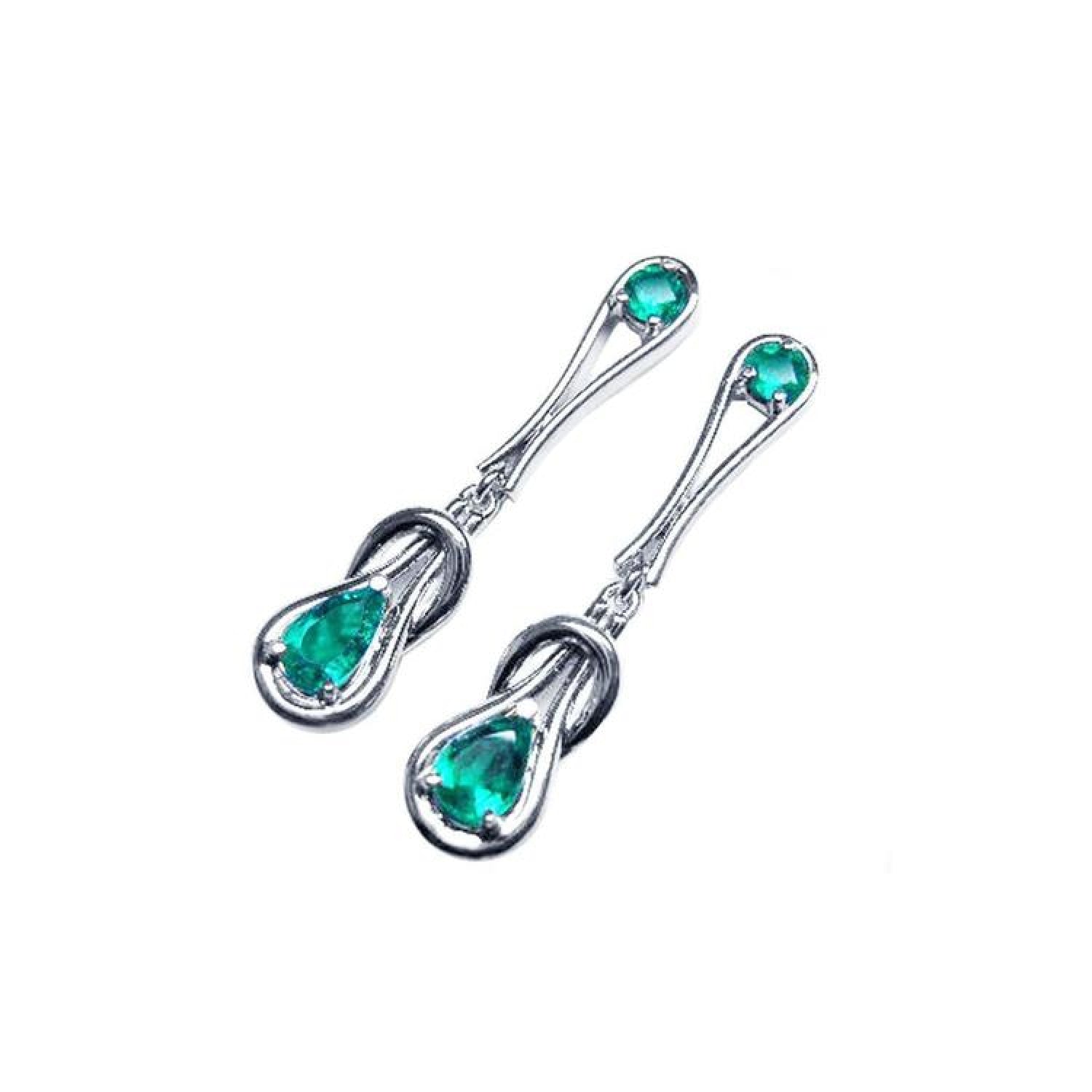 14K white gold love knot earrings with pear-shaped and round Colombian emeralds.