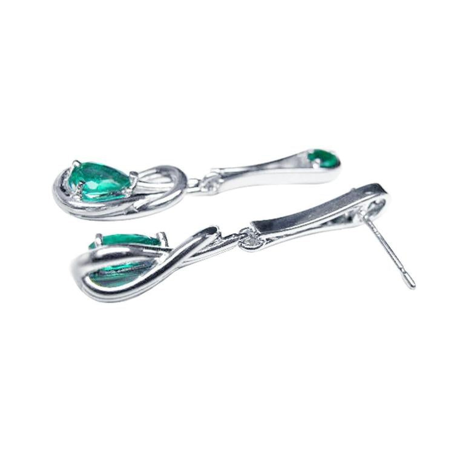 Pair of 14K white gold love knot earrings with pear-shaped Colombian emeralds.
