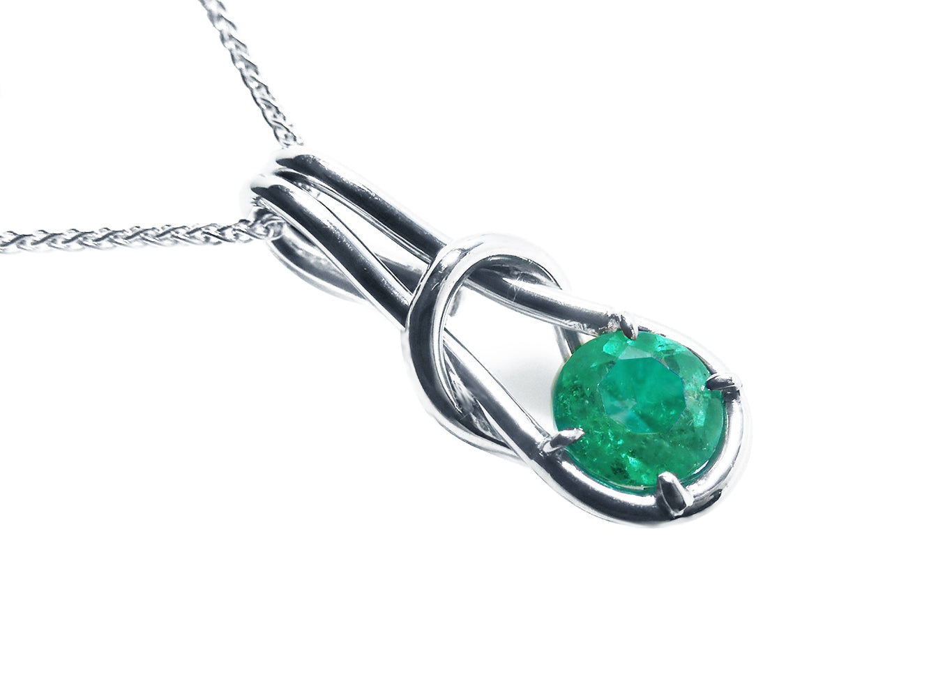 Love knot natural emerald pendant necklace in 14k white gold, top and right-side profile view.