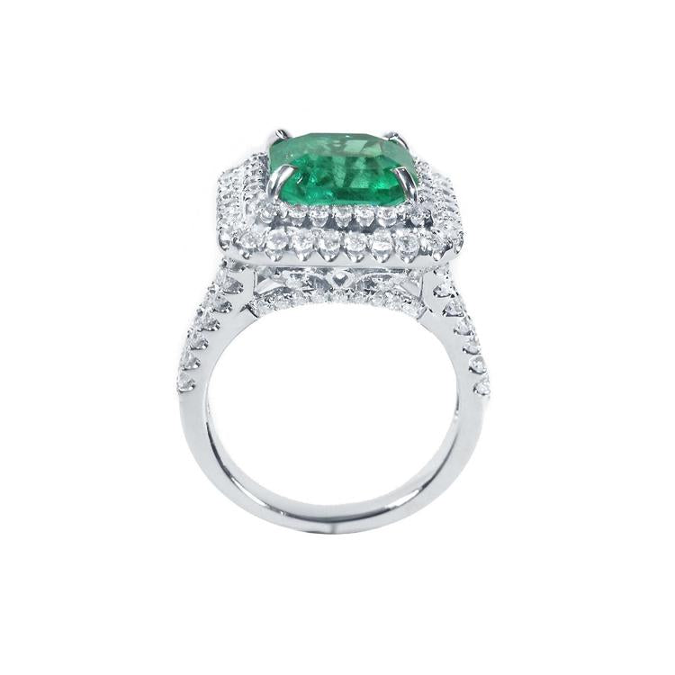 4.14 ct GIA-certified F1 Colombian emerald ring with diamond halo and band in 14K white gold.