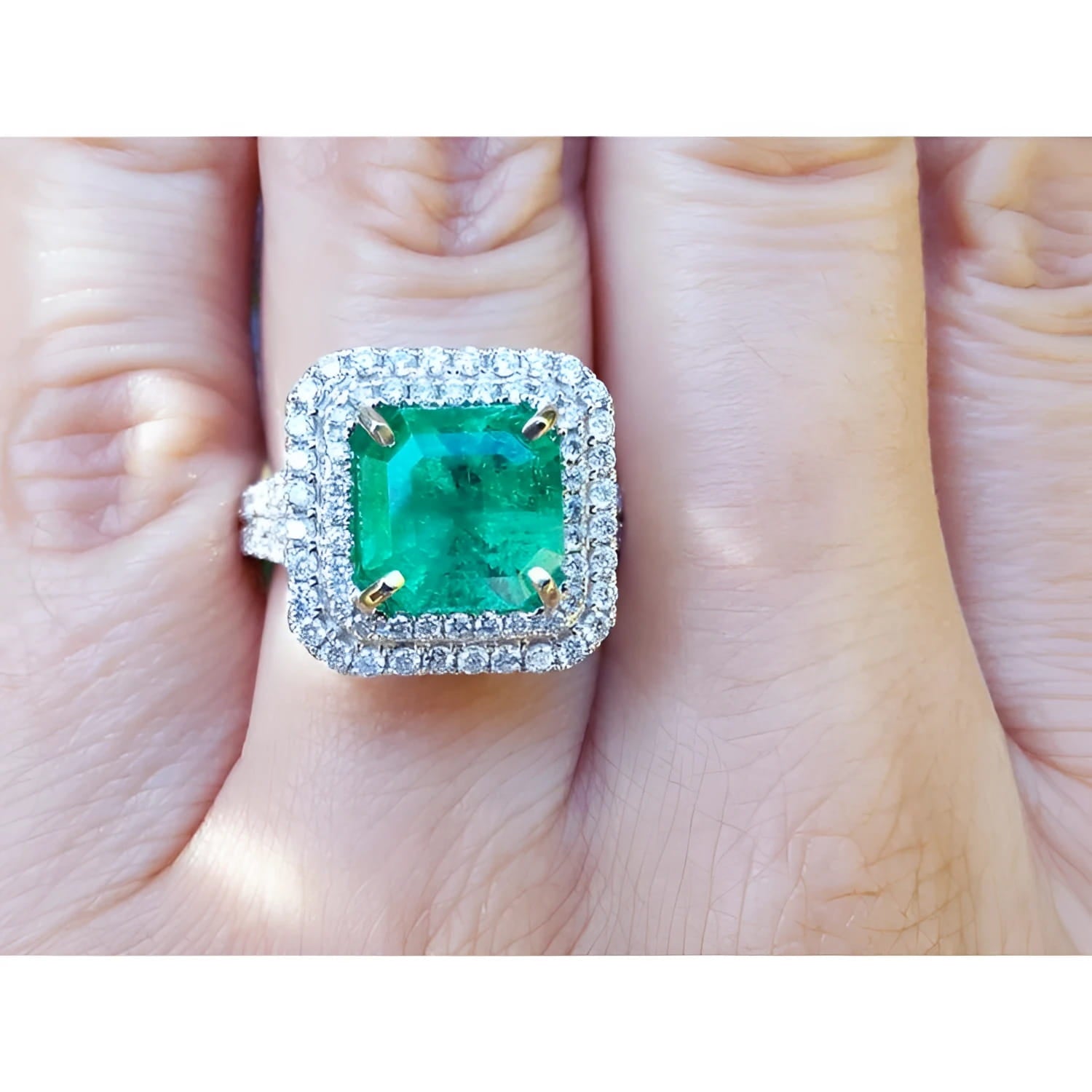 Natural colombian emerald ring GIA certified in a halo natural diamond crafted in 14k white gold.