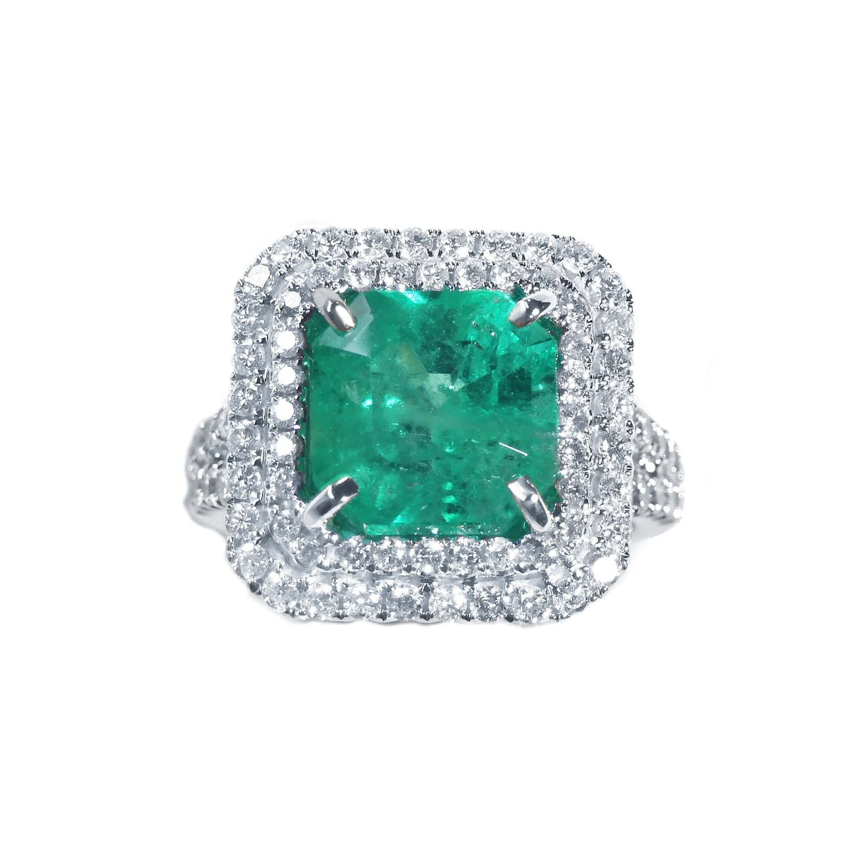 A double halo of natural diamonds encircling a square natural colombian emerald, 14k white gold ring