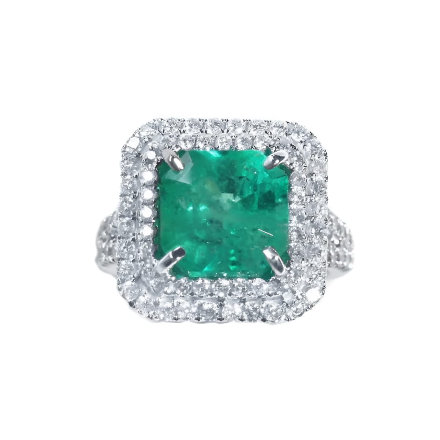 4.14 ct GIA F1 Colombian emerald ring with diamond halo and band in 14K white gold.