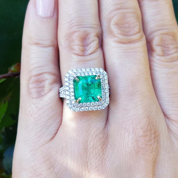 4.14 ct GIA-certified F1 Colombian emerald ring with diamond halo in 14K white gold.