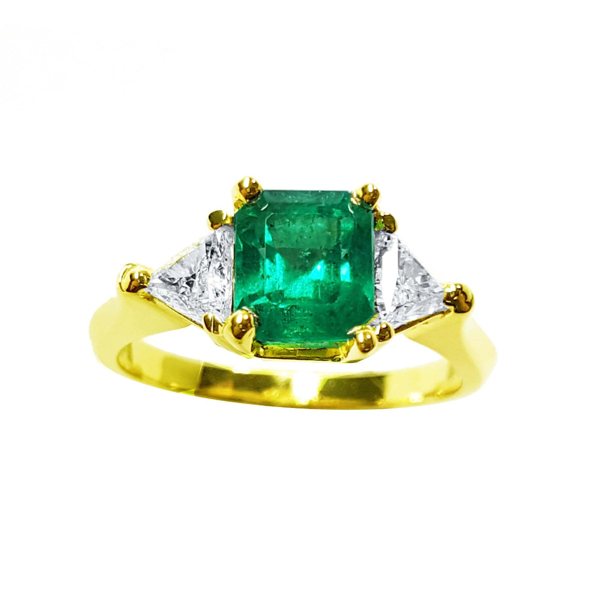 Natural colombian emerald three stone ring with side trillion cut diamonds for women, crafted in 18k yellow gold.
