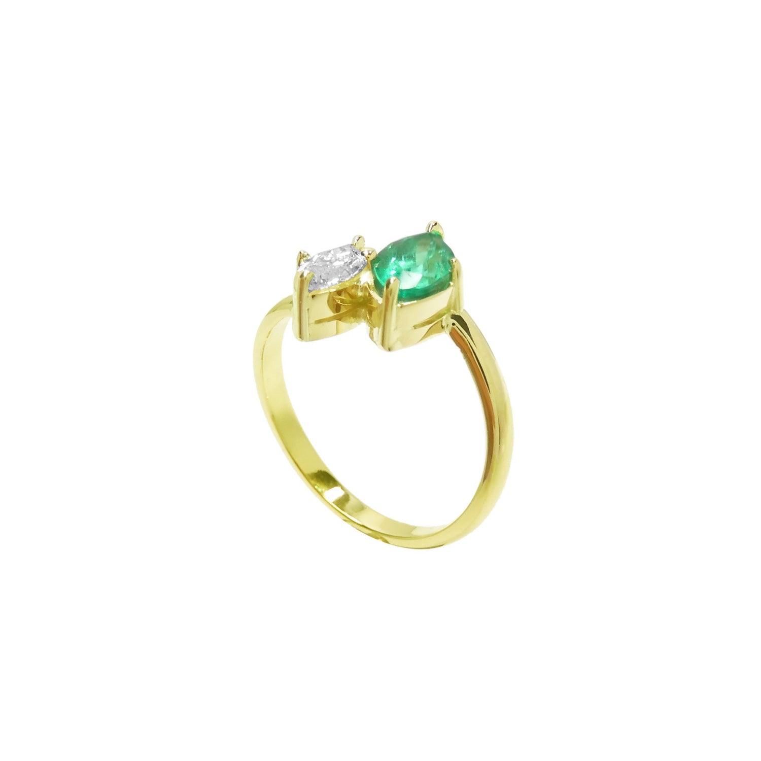This stunning You and Me ring showcases a marquise-cut emerald paired with a natural diamond accent.