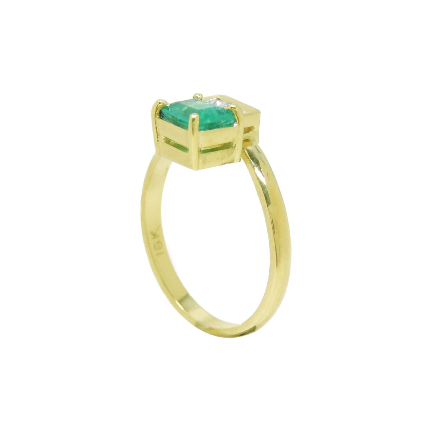 A handcrafted 18k yellow gold you and me or toi et moi emerald and diamond engagement ring.