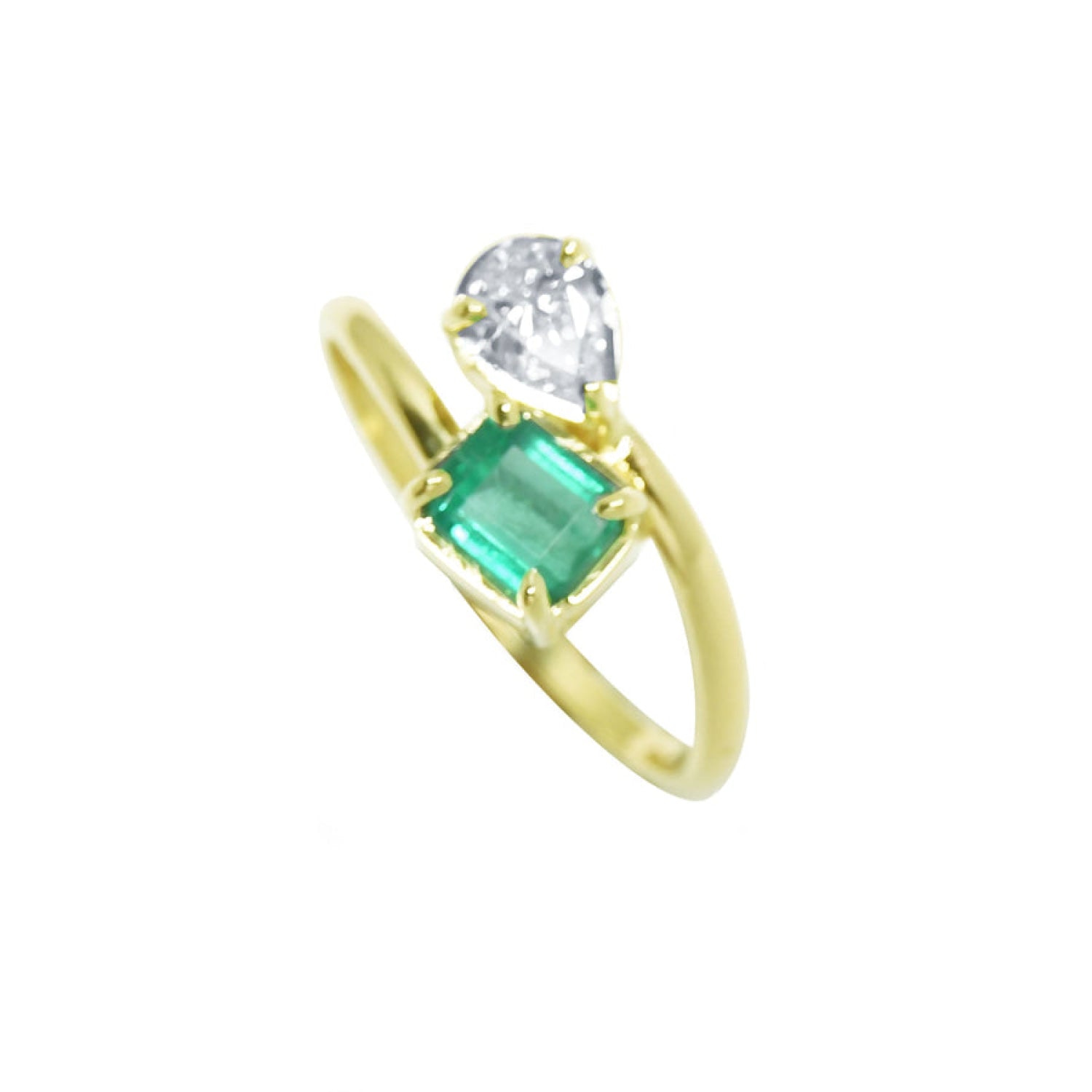 A 18k yellow gold you and me design ring featuring a rectangular emerald-cut gemstone and a pear-cut diamond.