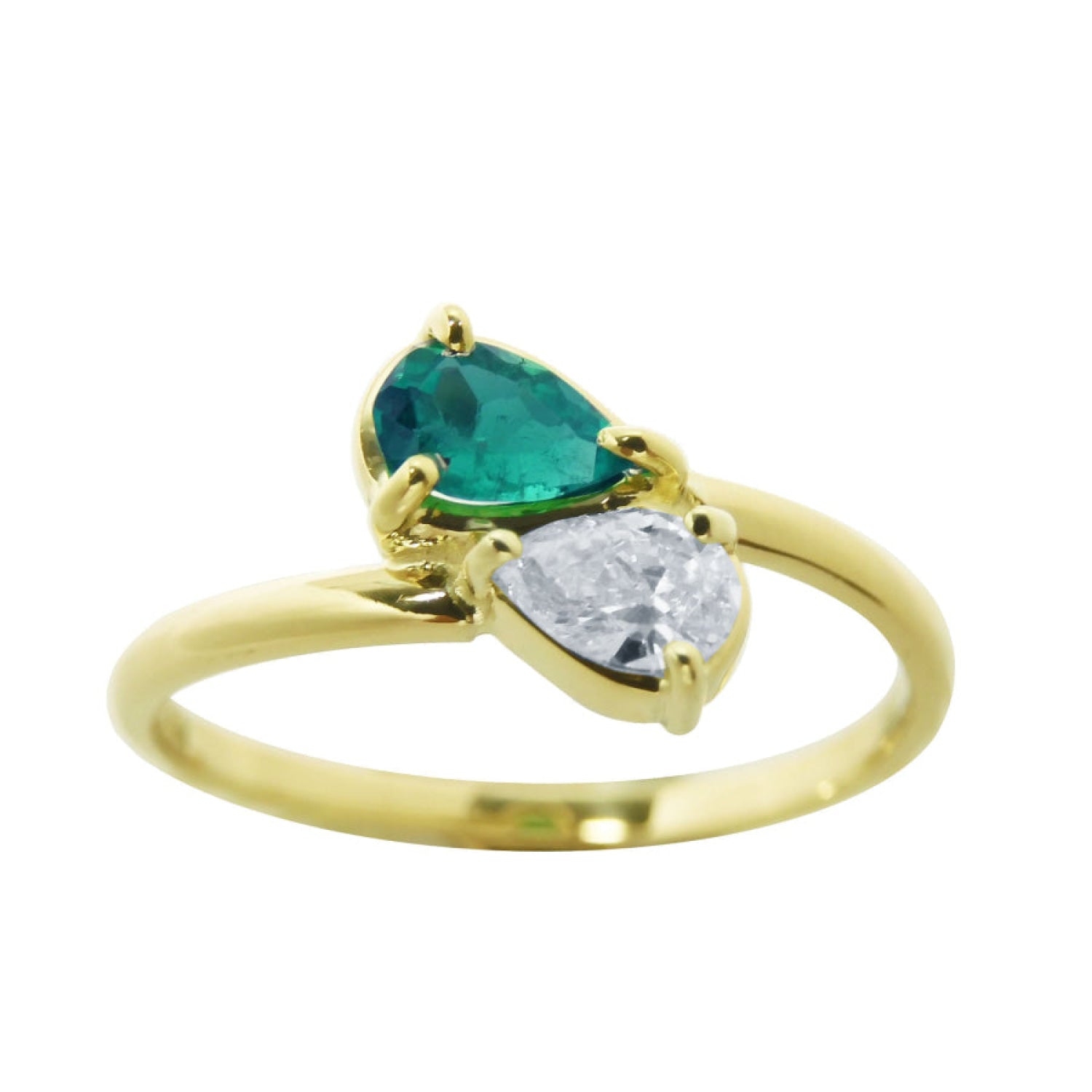 A 18k yellow gold You and Me ring featuring a pear-cut natural emerald and a pear-cut diamond, set on a polished gold band.