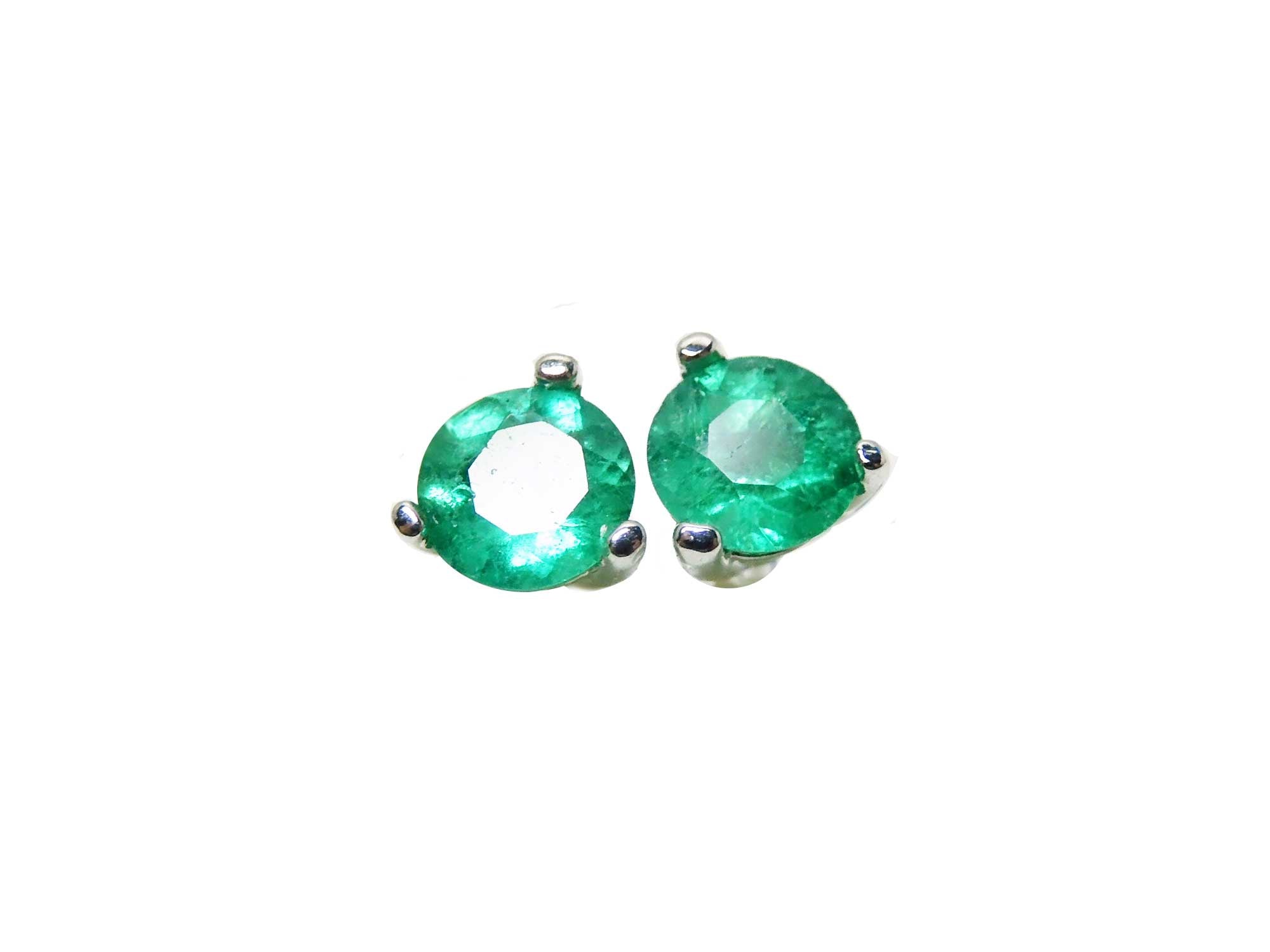 Pair of 14k white gold martini stud emerald earrings, front position top side view.