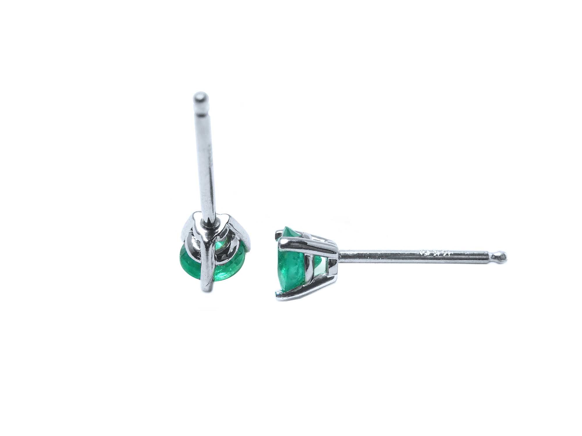 A pair of Colombian emerald martini stud earrings, upside down underside push backs view