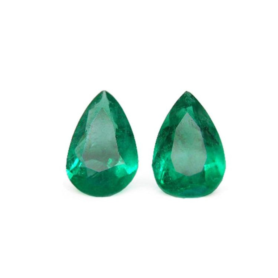 Matched pair set loose emeralds pear cut 3.62 ct. with a bluish-green tone.