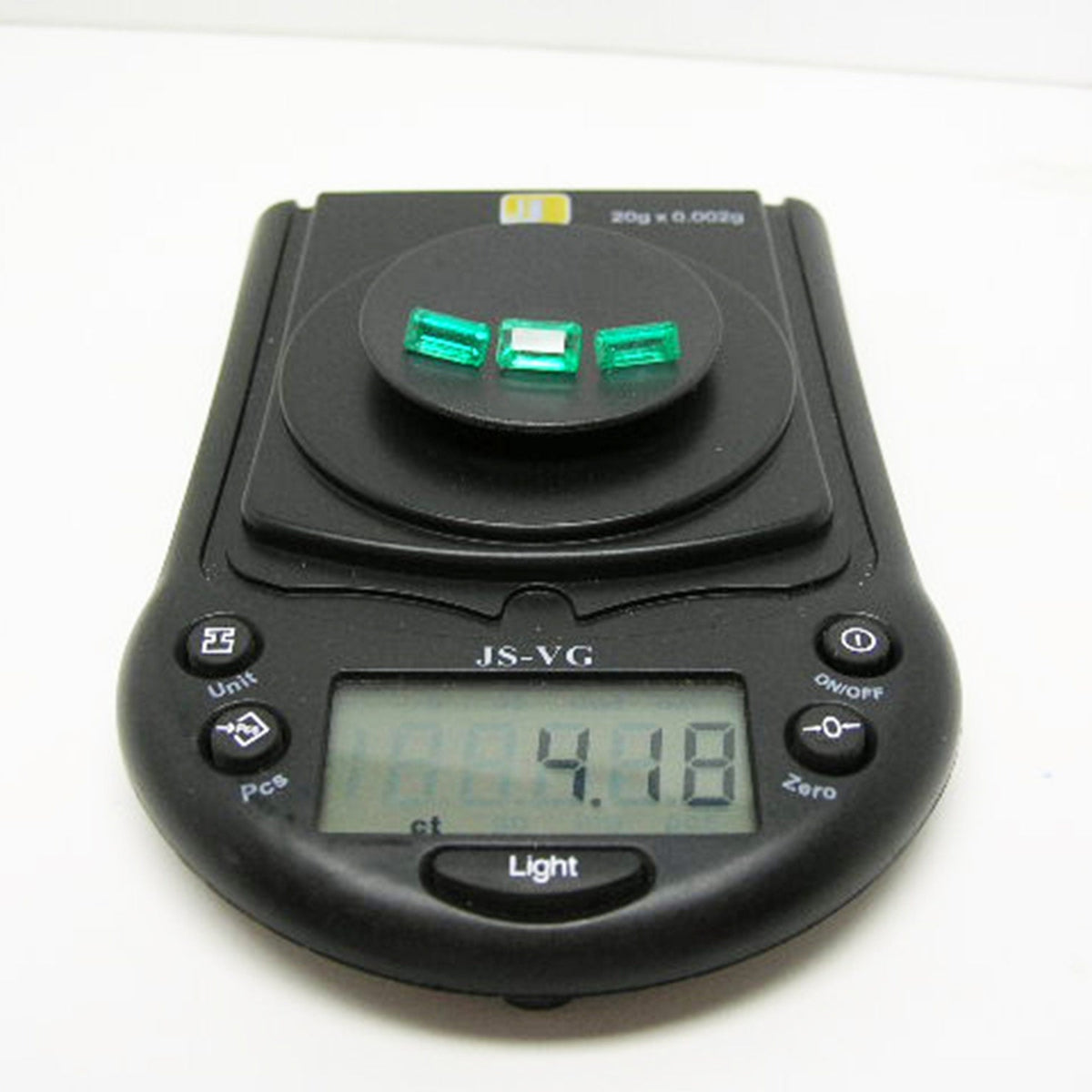 Loose natural emeralds matched set earrings pendant 4.18 Carats on digital scale for weight display