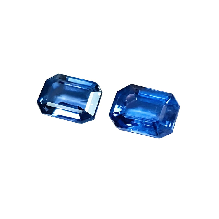 Natural blue sapphires matching pair emerald-cut for earrings, ideal for crafting elegant earrings.
