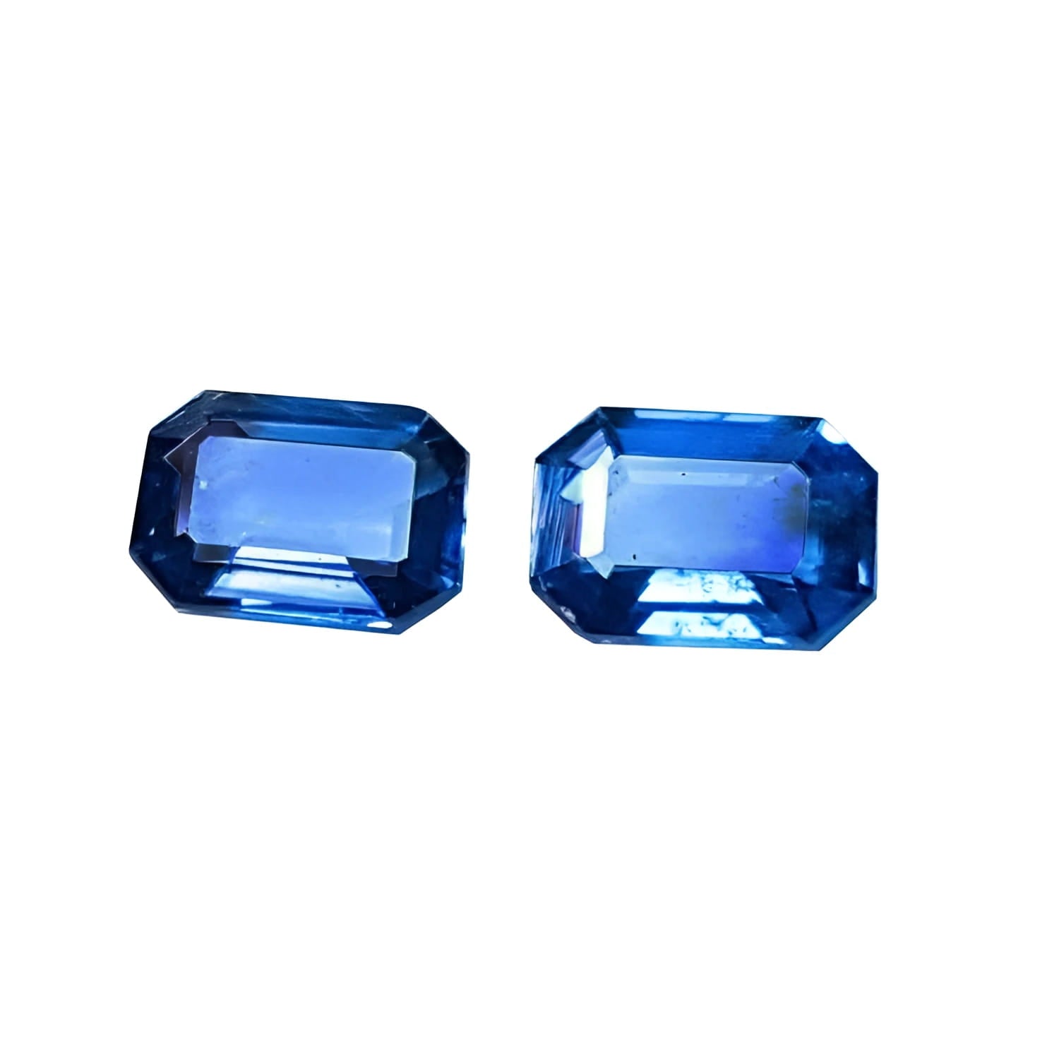 Natural blue sapphires matching pair emerald-cut for earrings, features a matching rectangular emerald cut, showcasing a vibrant medium blue hue.