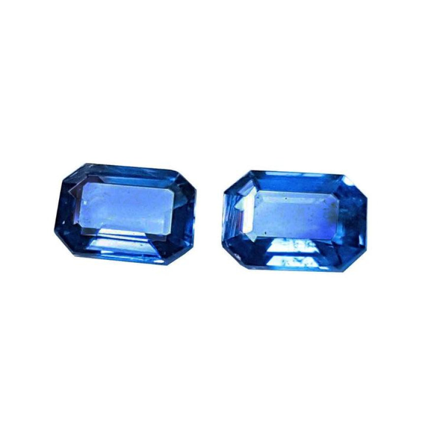Natural blue sapphires matching pair emerald-cut for earrings, features a matching rectangular emerald cut, showcasing a vibrant medium blue hue.