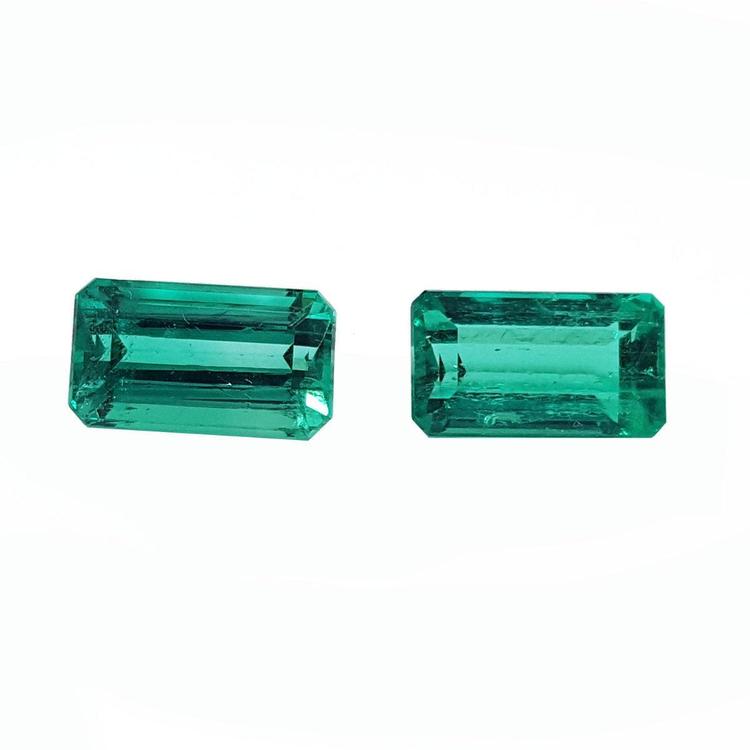 Matching pair of emerald-cut 3.38 ct. loose emeralds, vibrant bluish medium deep green.