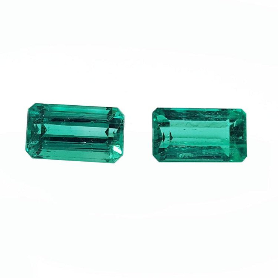 Matching pair of emerald-cut 3.38 ct. loose emeralds, vibrant bluish medium deep green.