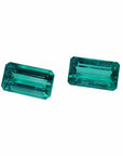 Emerald-cut matching pair loose emeralds from Muzo Colombia, left side tables and crowns exposed