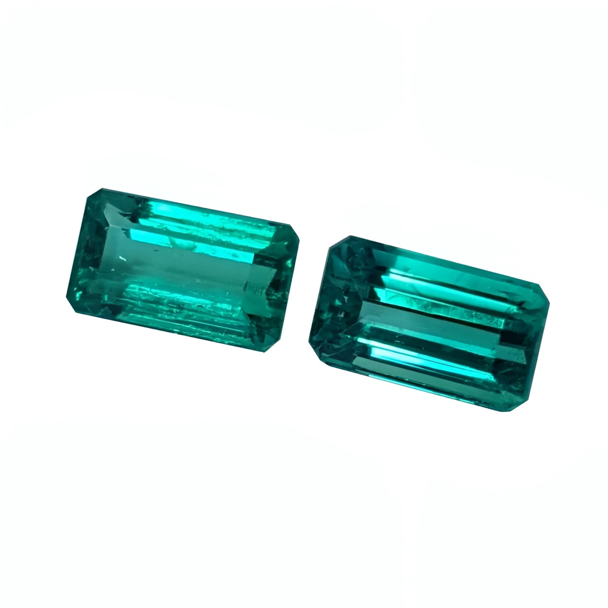 Emerald-cut matching pair loose natural emeralds from Muzo Colombia, eye clean vibrant bluish medium deep green color.