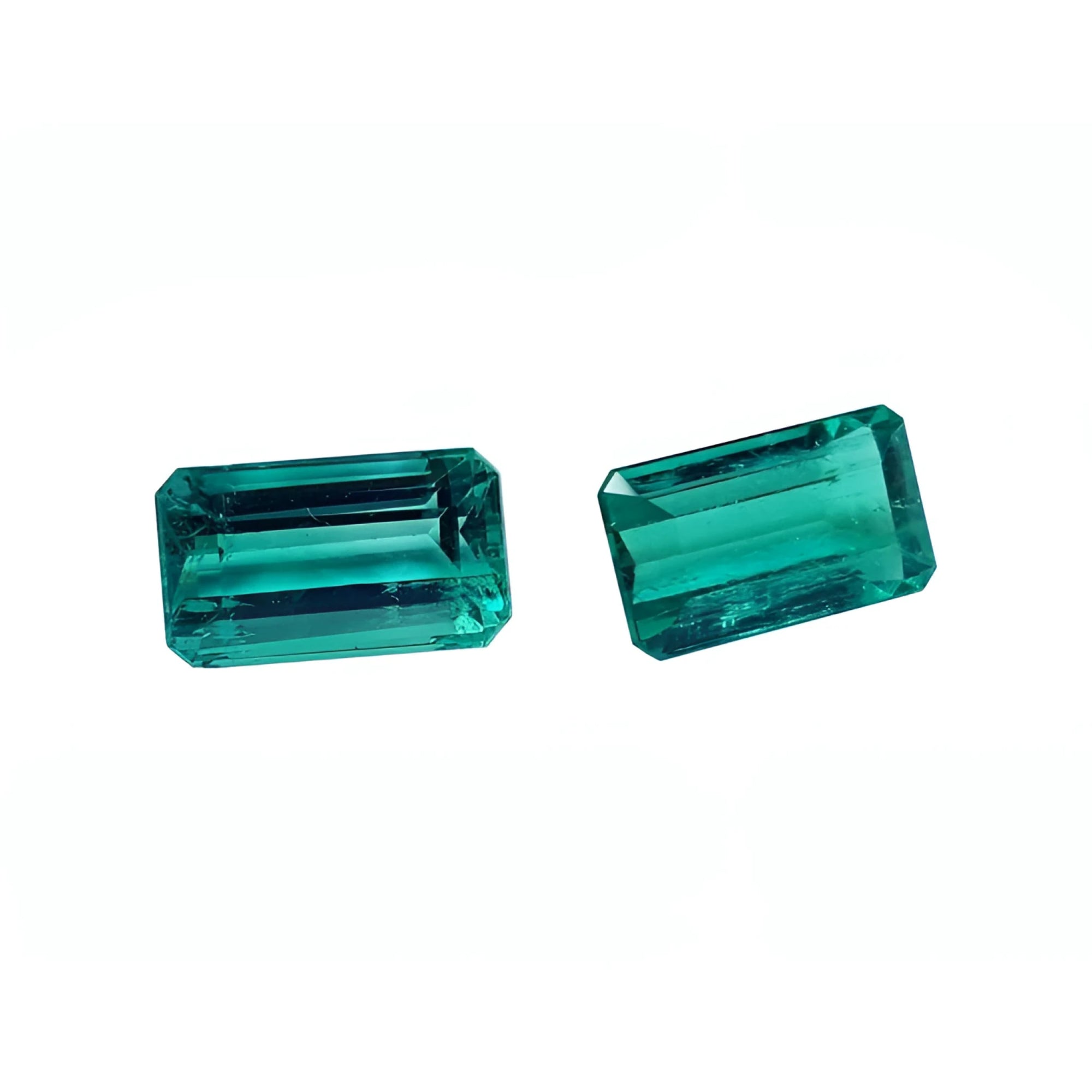 Emerald-cut 3.38 ct. matching pair of loose, vibrant bluish-green Colombian emeralds.