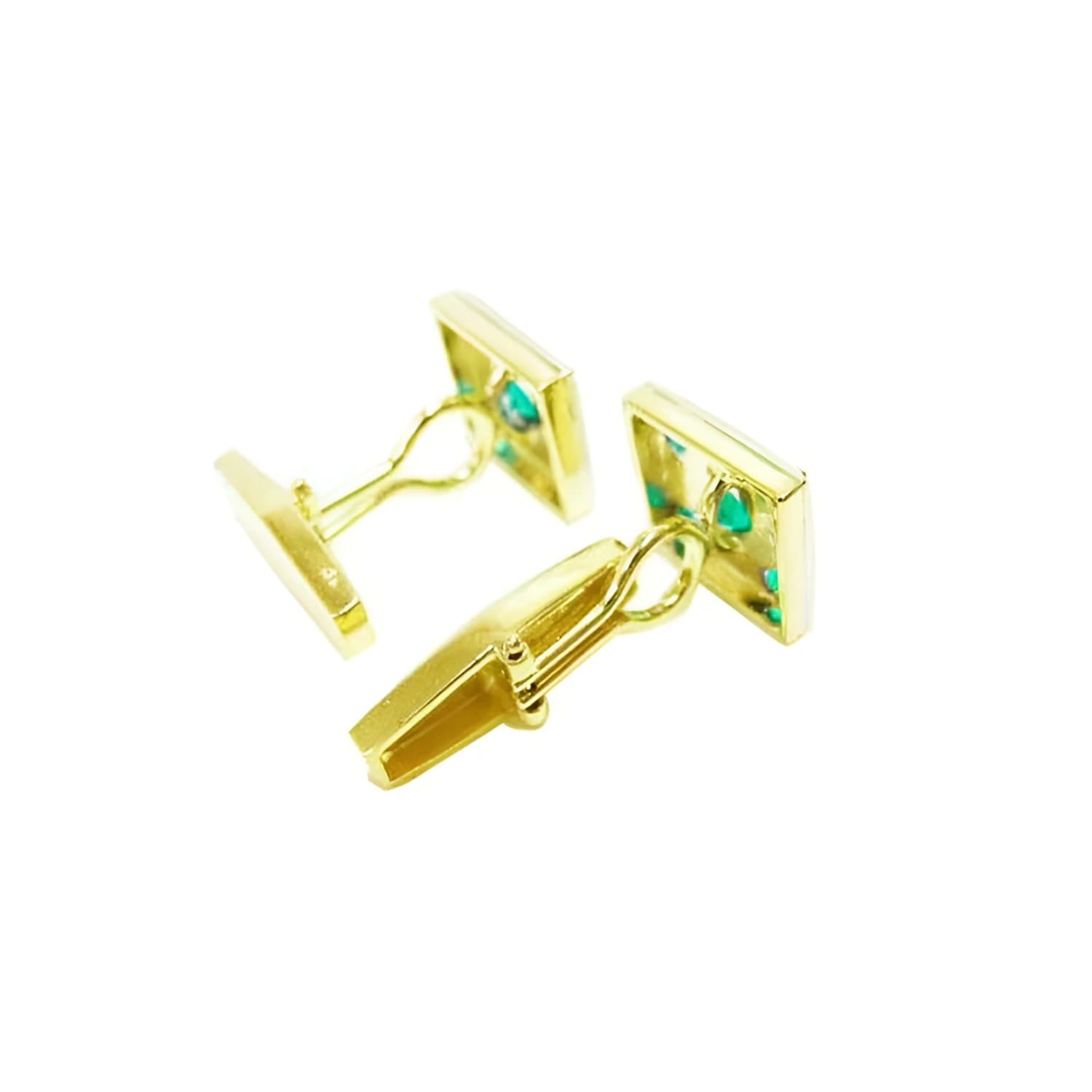 Pair of 14K yellow gold cufflinks with square emerald-set faces and a hinged back.