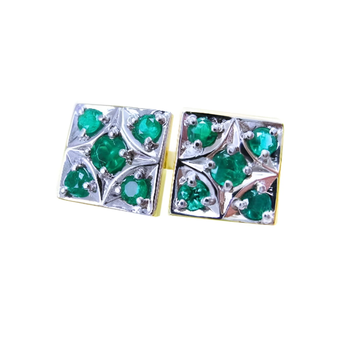 A pair of cufflinks with natural colombian emeralds rund cut in 14k white and yellow gold.
