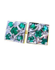 A pair of cufflinks with natural colombian emeralds rund cut in 14k white and yellow gold.