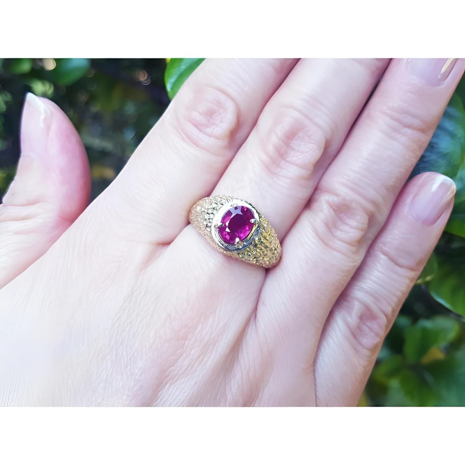 Men's 18K yellow gold ring with a sparkling pinkish-red oval Burma ruby, prong-set.