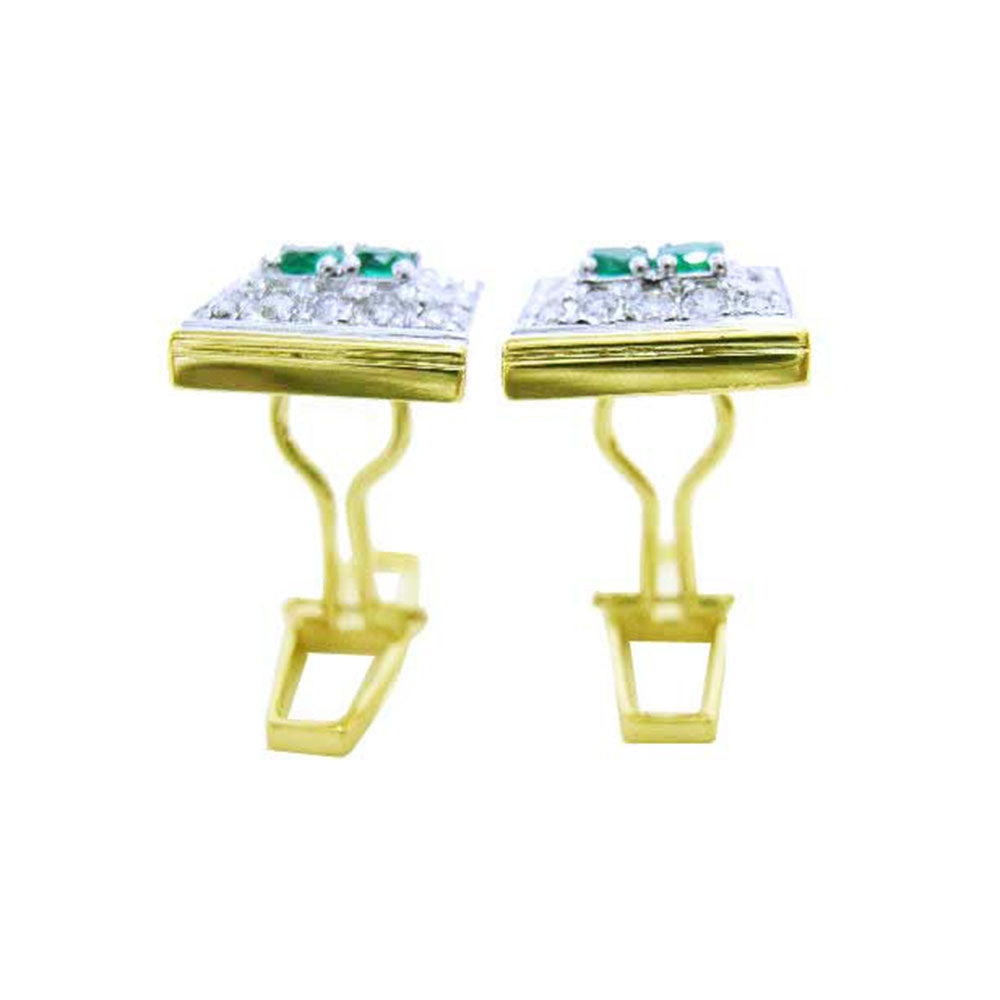 The downside profile view of a pair of yellow gold cufflinks foe men with real emeralds and diamonds/