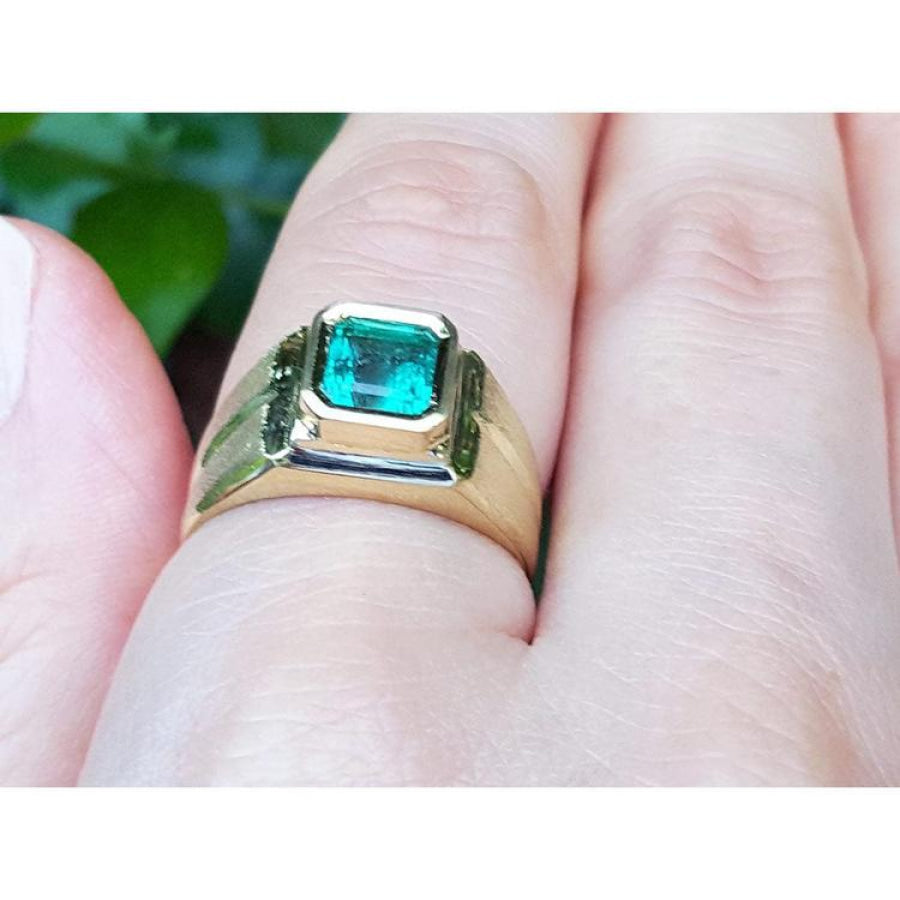 Men's 18K yellow gold pinky ring with a bezel-set, square-cut Colombian emerald.