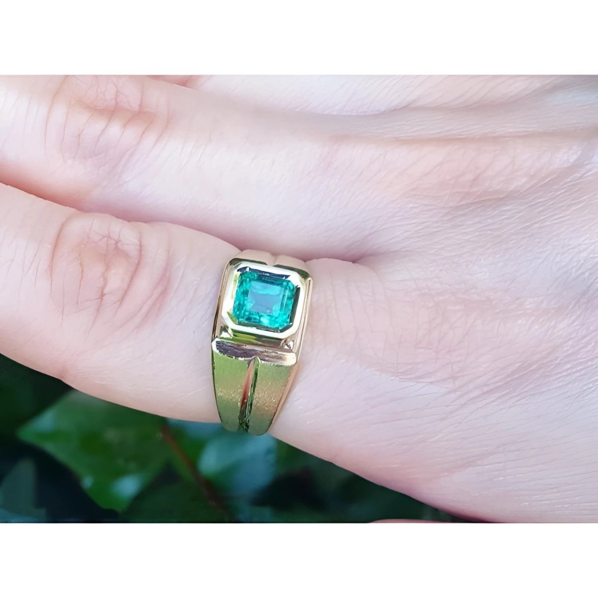 Men's 18K yellow gold pinky ring with a bezel-set, square-cut emerald.