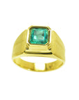 Gold emerald pinky ring for men on a white background.