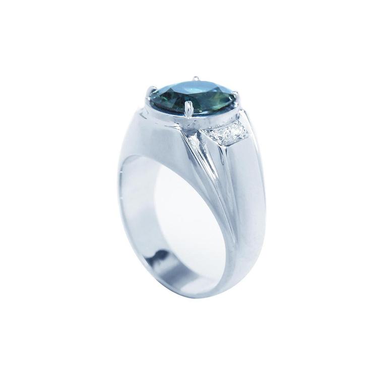 Men's 14K white gold ring with a deep greenish-blue oval cut Australian sapphire and diamond accents.