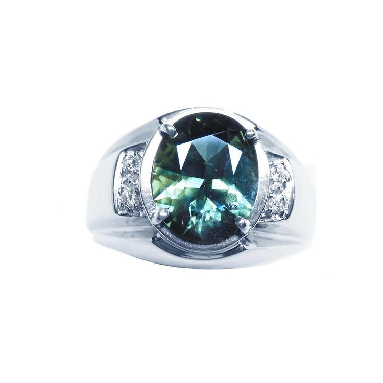 Men's 14K white gold ring with a large oval-cut greenish-blue sapphire and diamond accents.