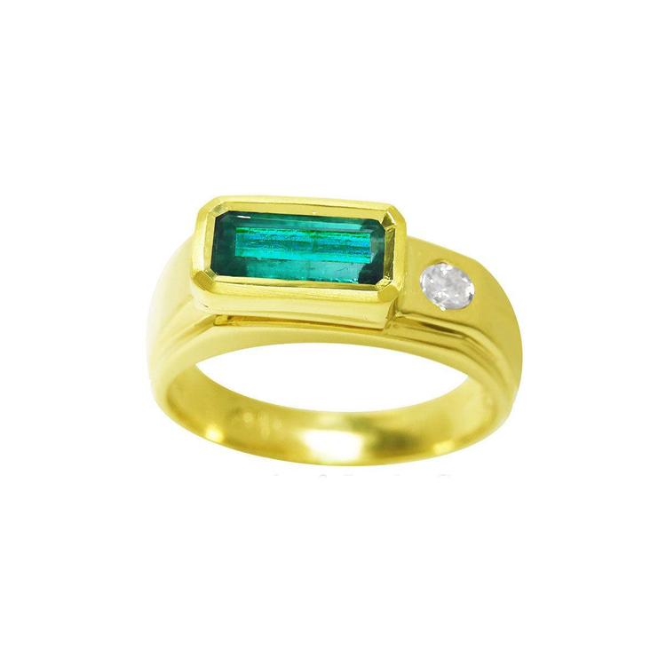 This yellow gold bezel set emerald ring for men shows the topside profile and band design.