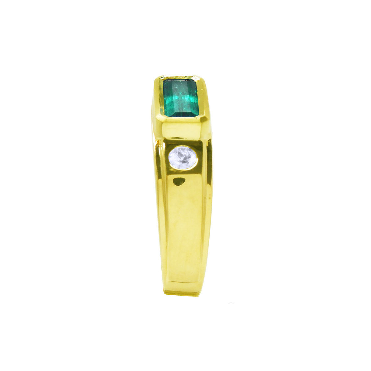 The side profile of this yellow gold ring for men shows the rectangular colombian emerald on top and a diamond accent.