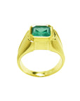 A yellow gold mens emerald solitaire ring bezel set displaying its lateral perspective.