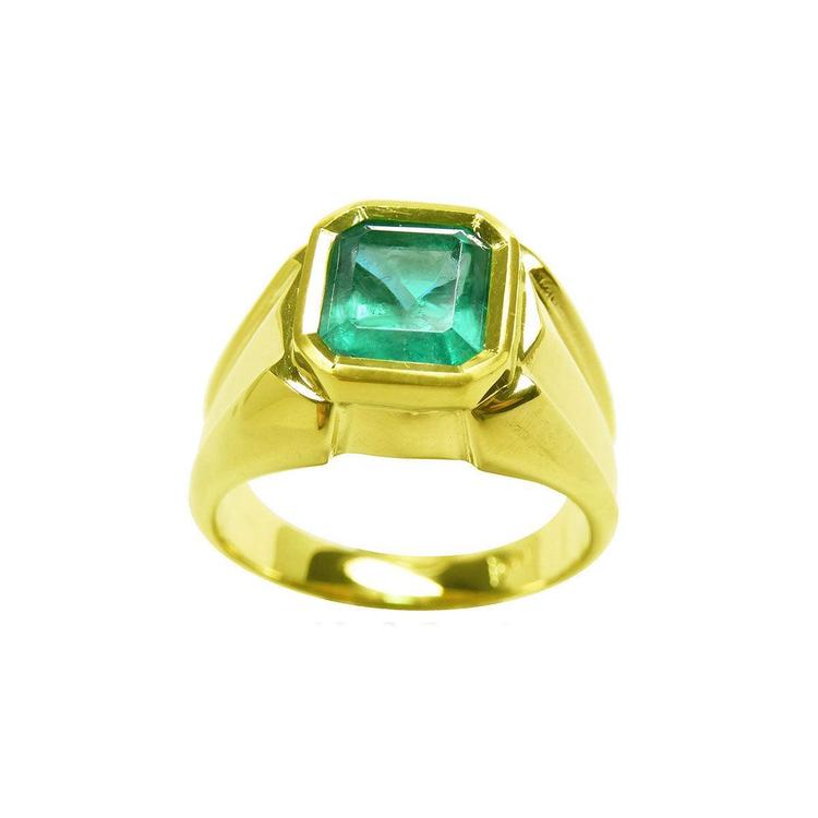 A solitaire mens emerald ring displaying the top and both sides design perspective.