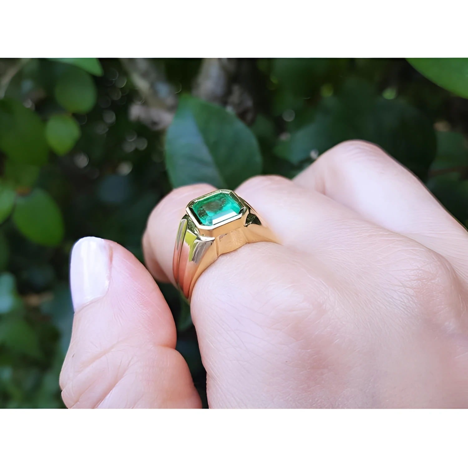 Men's 14K yellow gold solitaire ring with a square emerald-cut medium green emerald, bezel set.