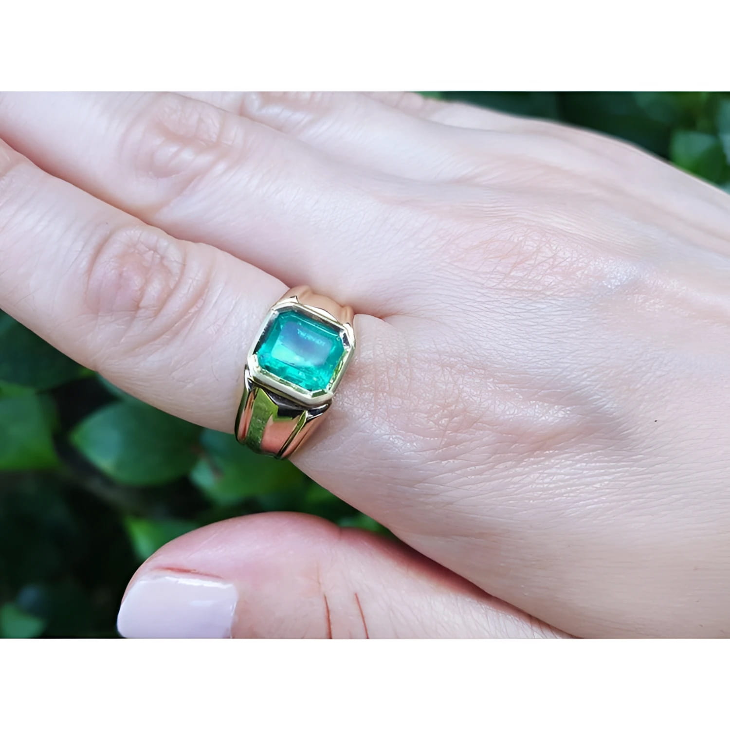 Men's 14K yellow gold solitaire ring with a square emerald-cut, medium green Colombian emerald.