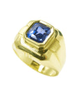 Quality men's sapphire solitaire ring emerald-cut Certified untreated 18K Yellow Gold, tilted top view perspective shoulders and shank