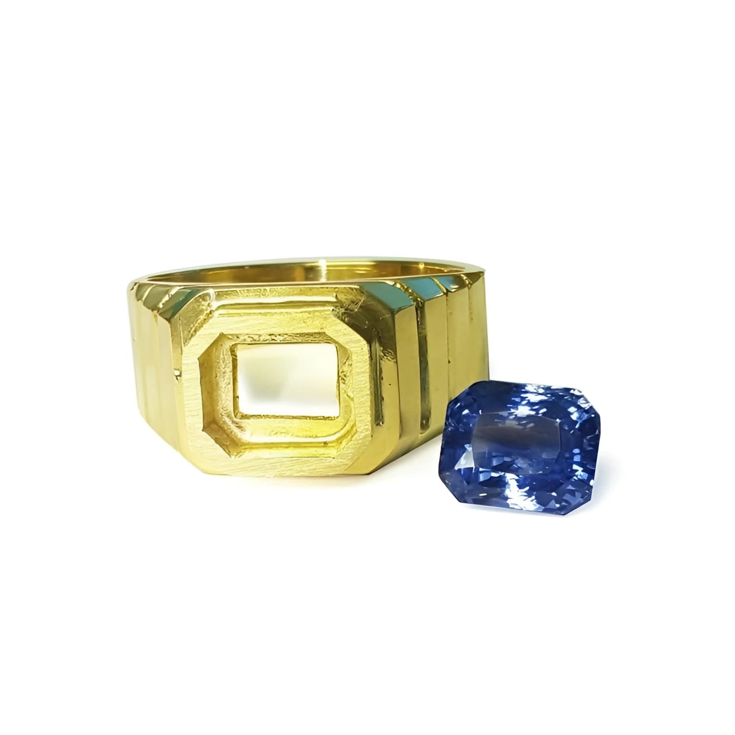 18k yellow gold men's ring setting with an octagonal bezel next to a loose blue sapphire.