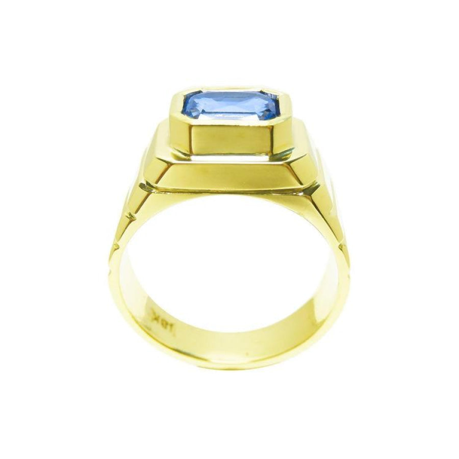 Men's 18k yellow gold ring with a bezel-set, octagonal blue sapphire.
