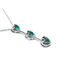 14K white gold heart journey pendant necklace with three round-cut Colombian emeralds.