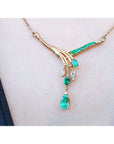14K yellow gold necklace with marquise and pear shaped Colombian emeralds and diamonds.