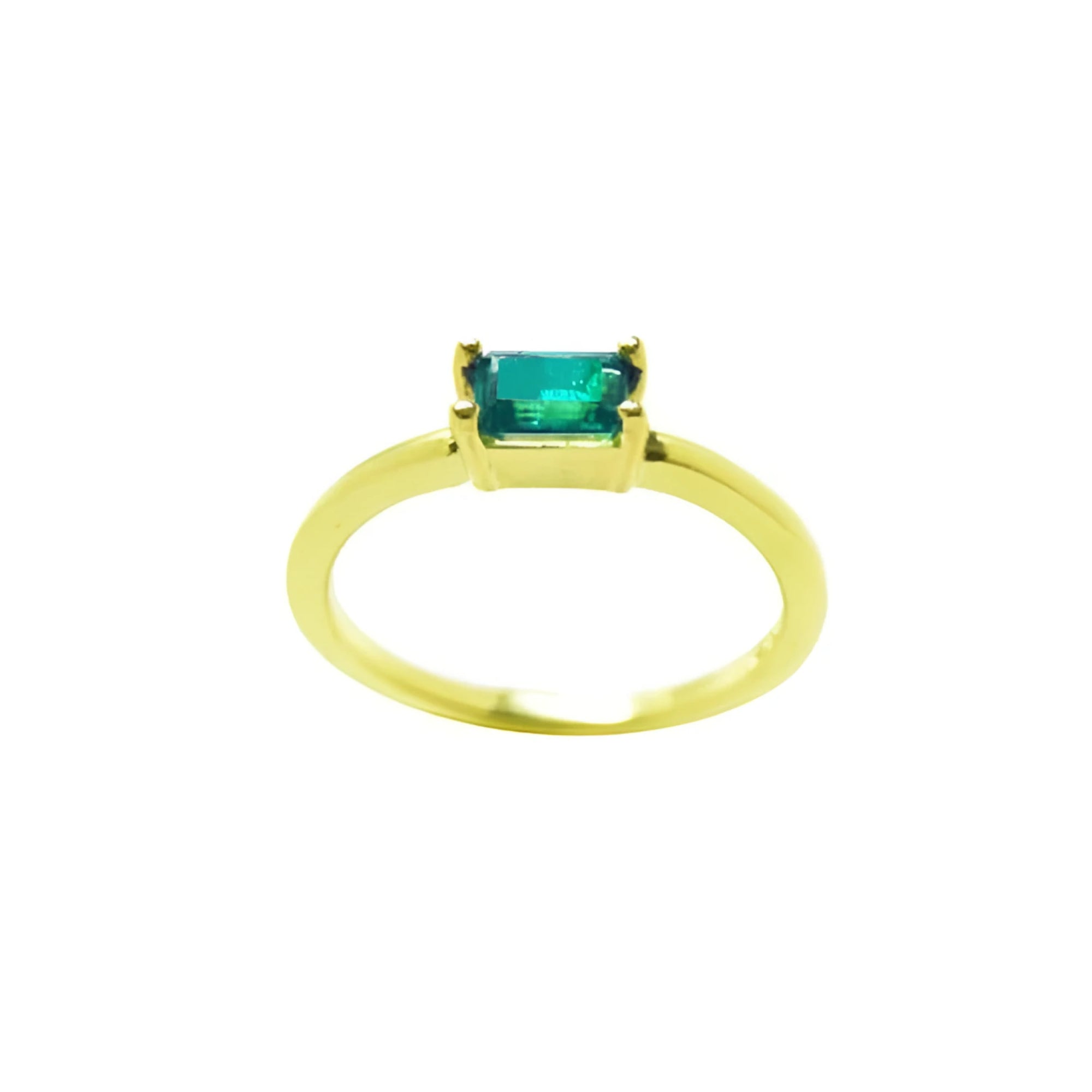Minimalist 14K yellow gold ring with a 0.35 ct. east-west emerald cut green solitaire.