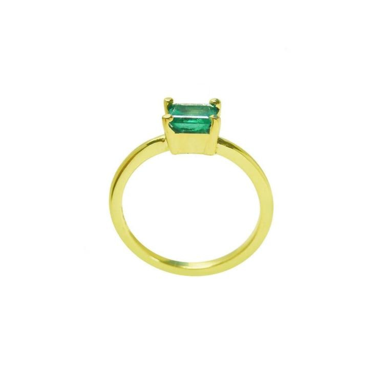 Minimalist 14K yellow gold solitaire ring with a rectangular green emerald.