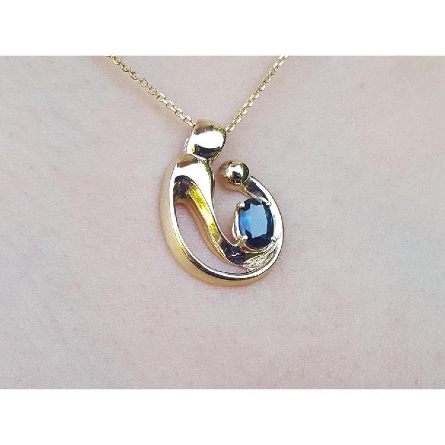 14K yellow gold mother and child slider pendant necklace with a deep blue sapphire.